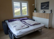 Ferienwohnung Wohnzimmer mit Schlafsofa von Bali